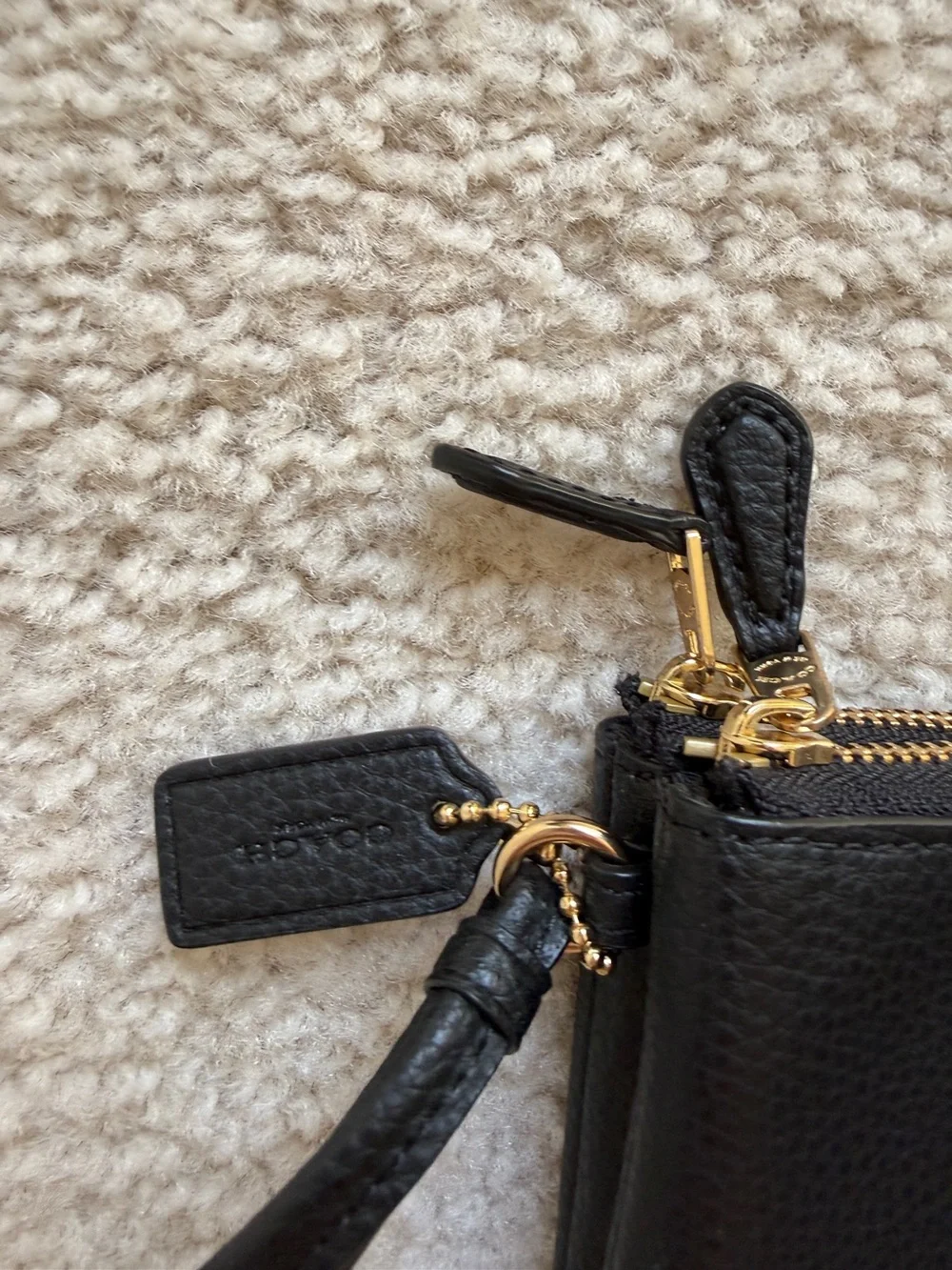 Coach Black Pebbled Leather Pouch with Gold Emblem